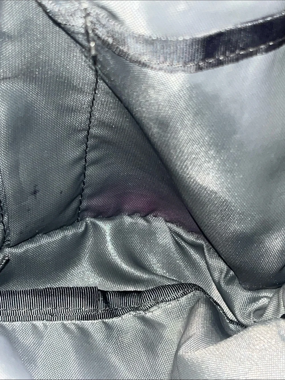 The NorthFace Jester Black Backpack with Light Pink Bungee Cord